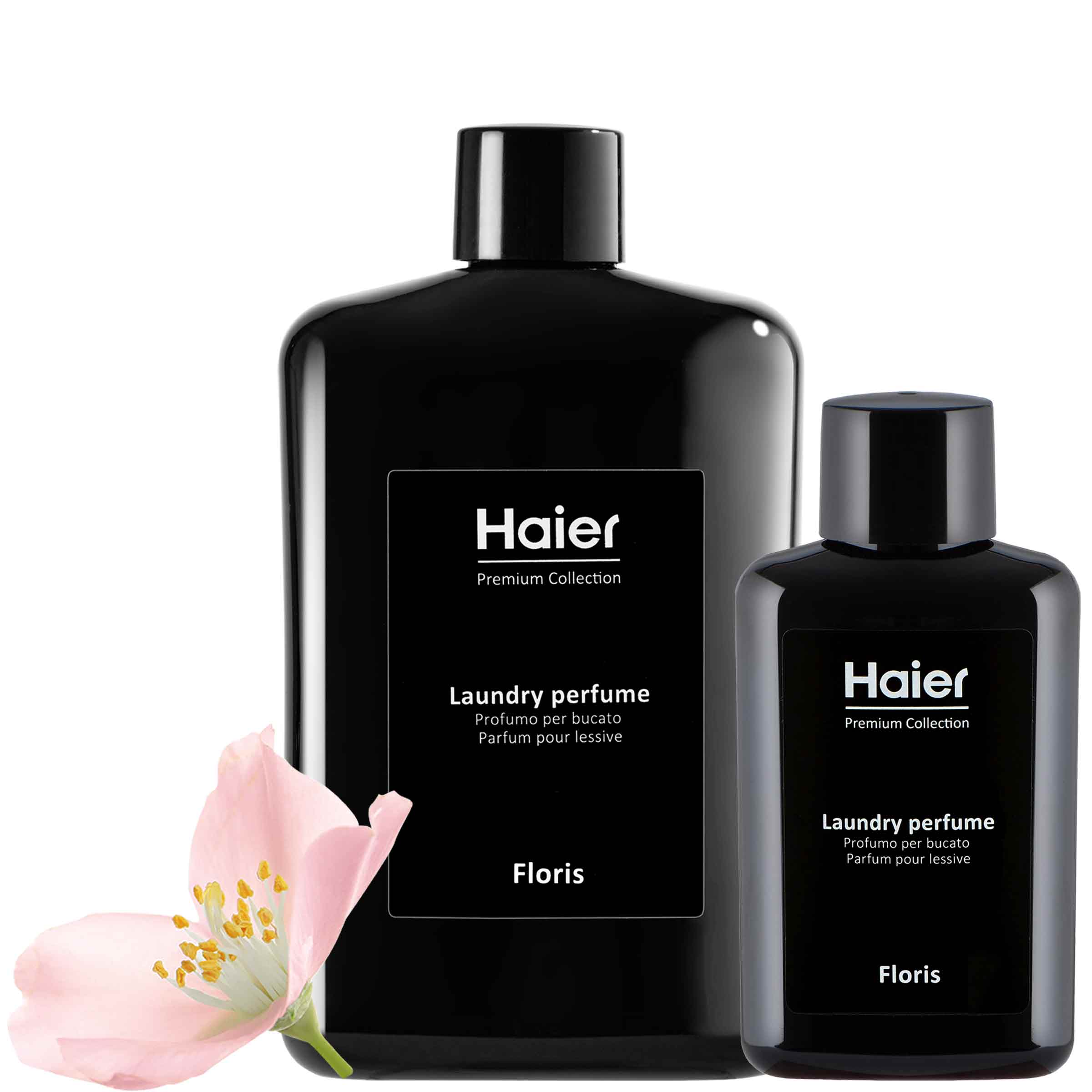 Black bottles labeled "Haier Premium Collection Laundry perfume" with "Floris" below, are shown next to a pink flower. Text includes "Profumo per bucato" and "Parfum pour lessive."