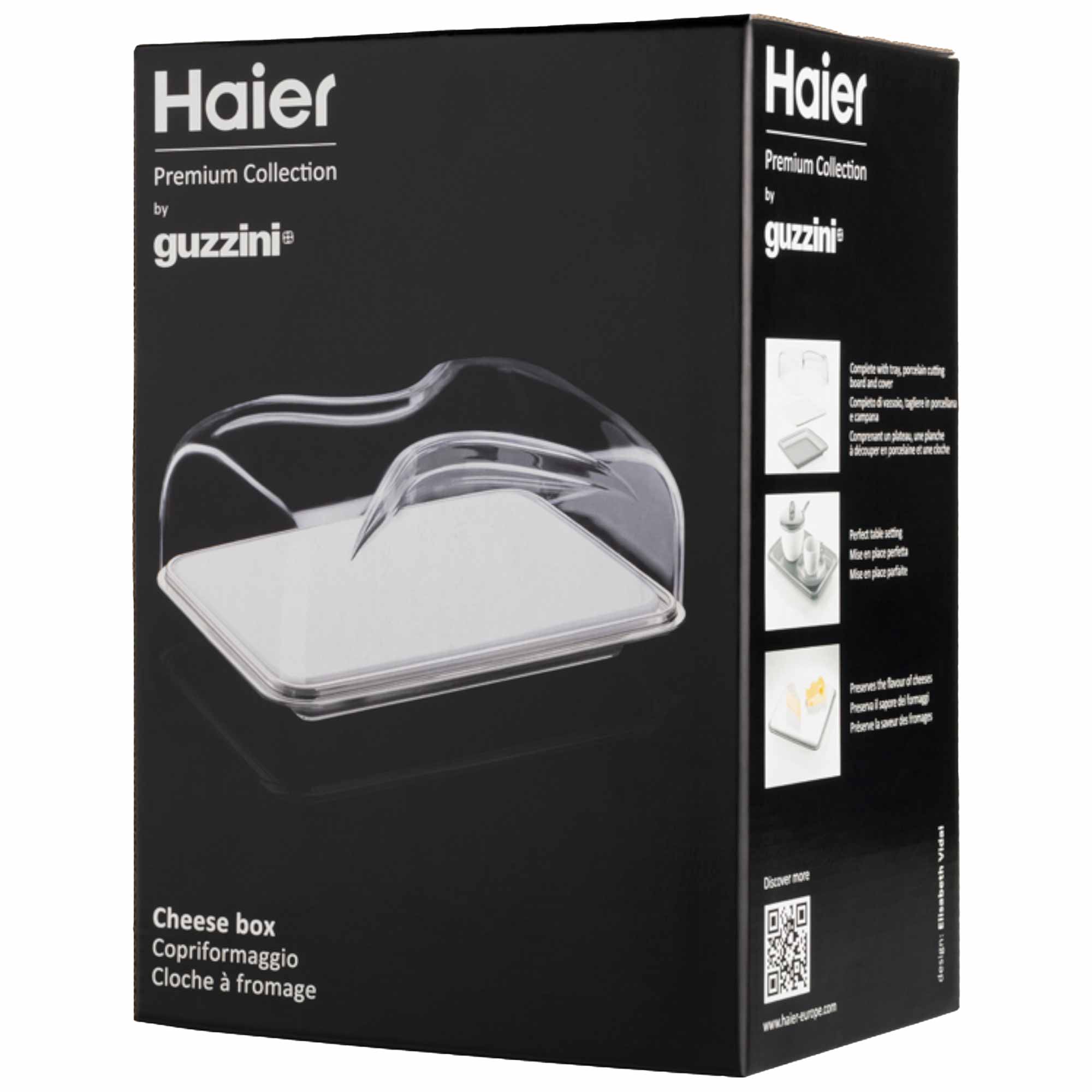 Cheese box with a transparent, curved lid on a rectangular base, displayed on a black packaging box. Text includes: "Haier Premium Collection by guzzini," "Cheese box Copriformaggio Cloche à fromage," and features details.