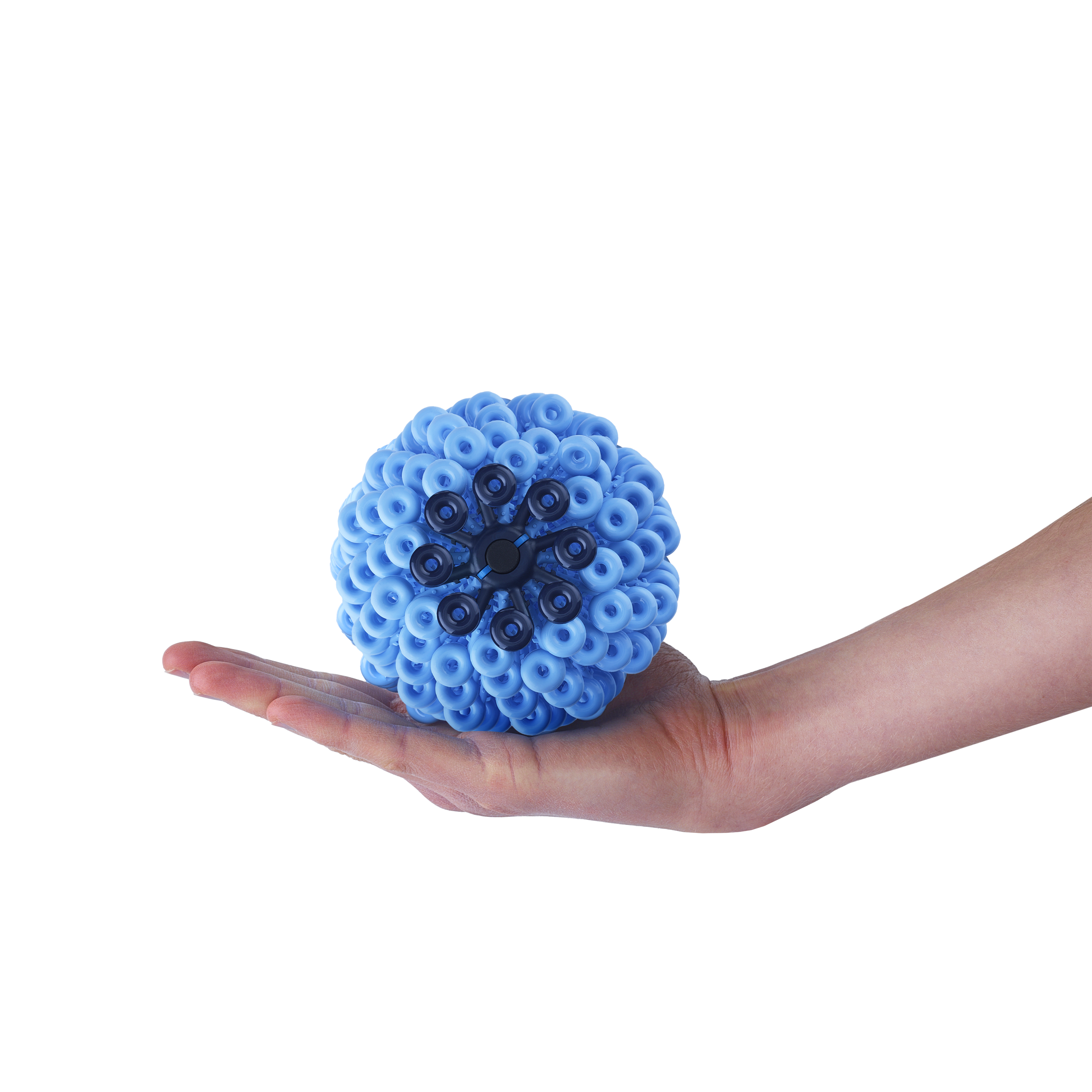 A blue textured sphere is resting on an open hand against a black background. The sphere is covered with circular protrusions and a dark central pattern.