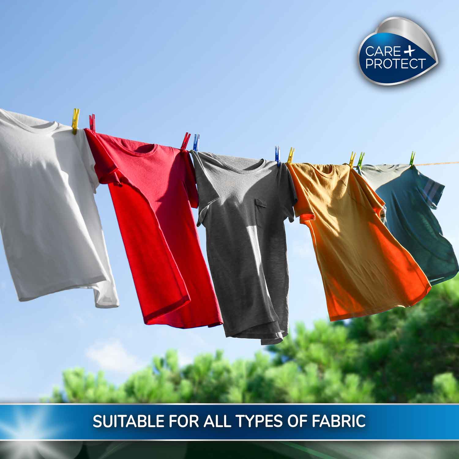 T-shirts in various colours hang on a clothesline with clothespins under a clear blue sky. Accompanied text reads "SUITABLE FOR ALL TYPES OF FABRIC," with "CARE PROTECT" logo in the corner.