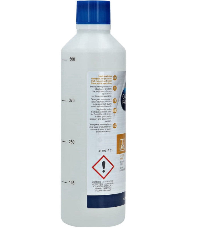 A translucent bottle with a blue cap displays measurement markings and safety text. It contains a sanitising detergent ideal for vacuum products, with warnings and descriptions in multiple languages.
