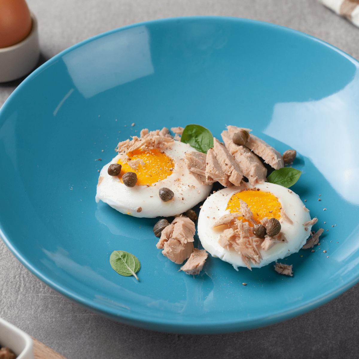 Boiled eggs with tuna and capers