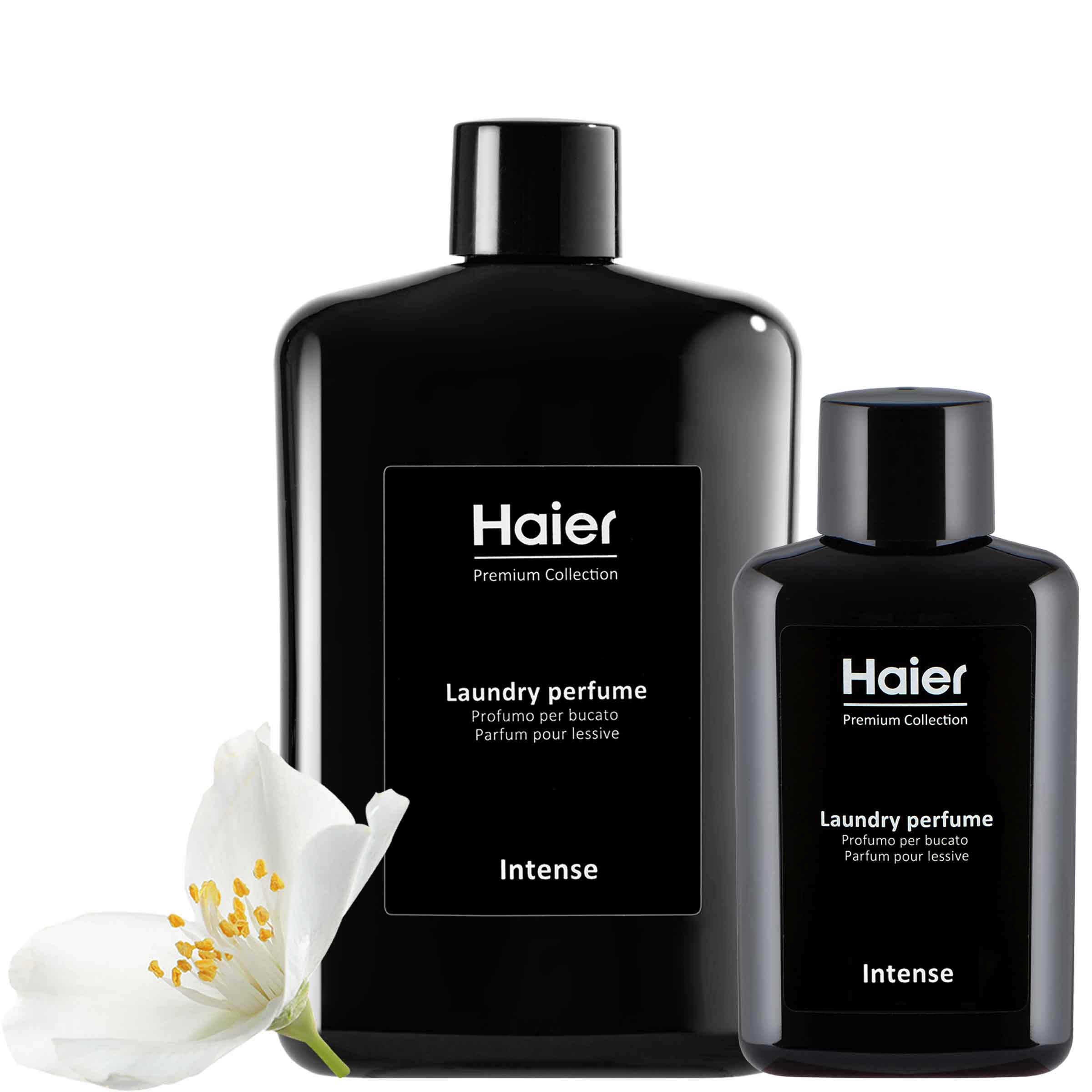 Two black bottles labeled "Haier Premium Collection Laundry Perfume," with "Intense" written below, stand adjacent to each other, accompanied by a white flower. Text includes "Profumo per bucato" and "Parfum pour lessive."